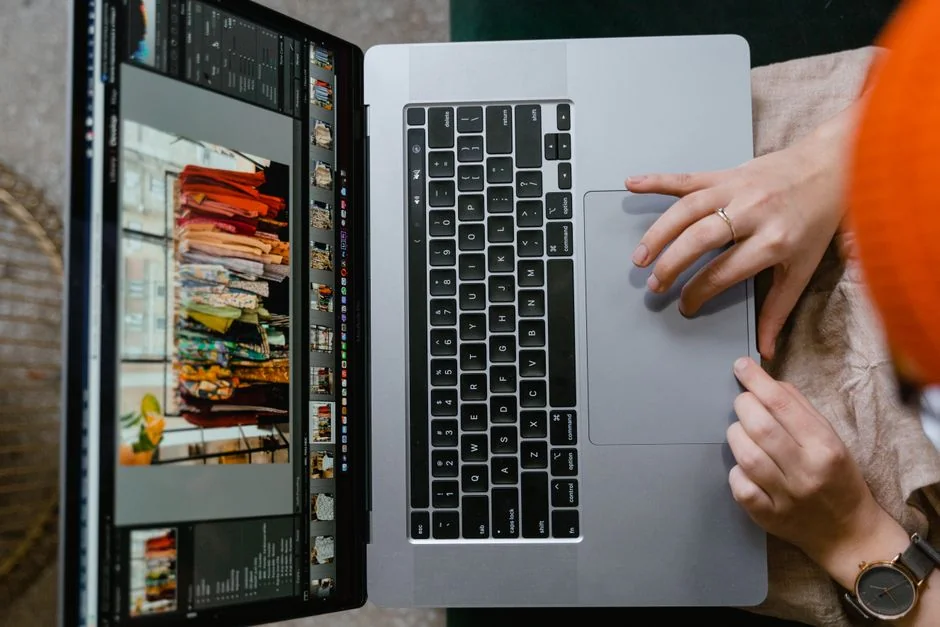 A modern workspace featuring dual computer monitors displaying web design projects, emphasizing technology and productivity.